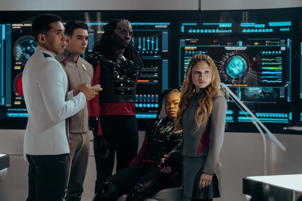L-R: Sandro Rosta as Caleb, George Hawkins as Darem, Karim Diané as Jay-Den, Kerrice Brooks as SAM, and Bella Shepard as Genesis in season 1, episode 6, of Star Trek: Starfleet Academy streaming on Paramount+. Photo Credit: John Medland/Paramount+