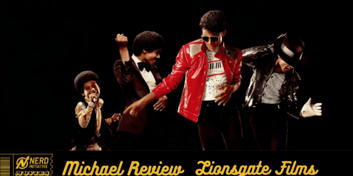 Group of male performers dancing on a dark stage; one wears a bright red jacket and sunglasses, others in retro outfits with energetic poses, bottom banner reads 'Michael Review Lionsgate Films'