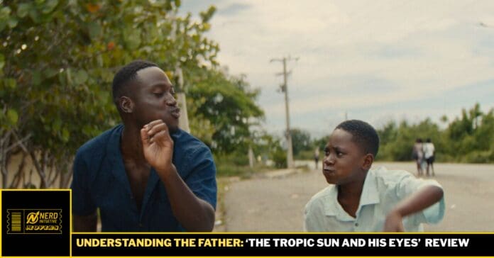 Two young men on a rural street share a playful moment, one making a puckered face toward the other, with a black-and-yellow banner bar reading 'Understanding the Father: The Tropic Sun and His Eyes' at the bottom.