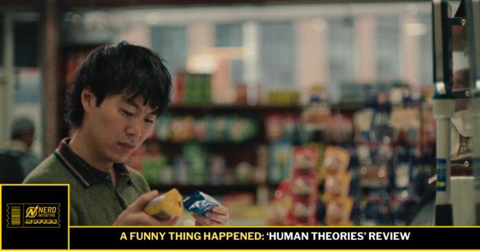 Man in a store examining two snack packets, appearing to review products for a video thumbnail labeled 'A Funny Thing Happened: Human Theories' Review.