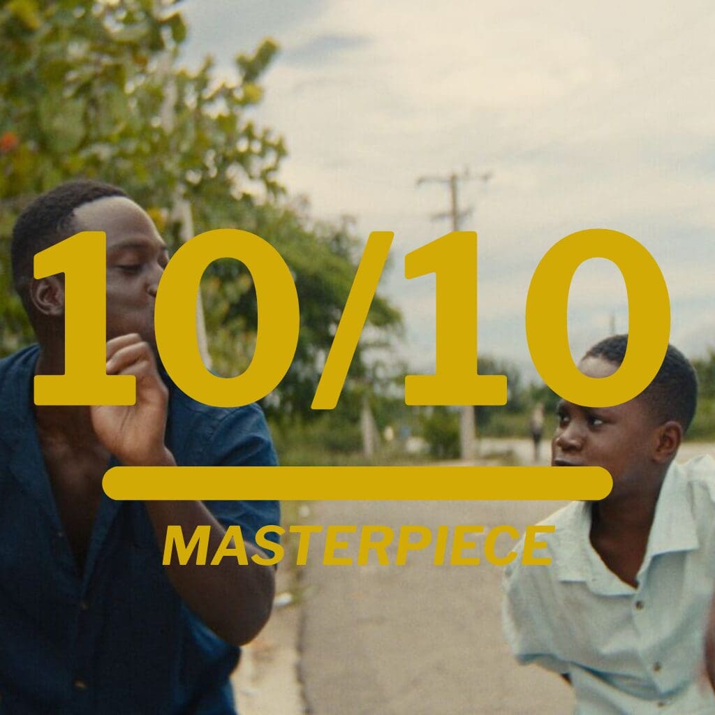 Two men on a sidewalk with bold gold text reading '10/10' and 'MASTERPIECE' overlay, suggesting a rating or compliment.