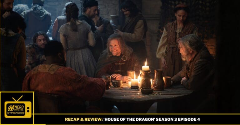 Medieval tavern scene with a man smiling at a candle-lit round table while others chat nearby.