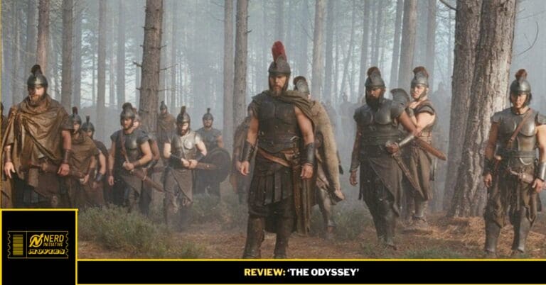 Group of Spartans marching through a misty forest, led by a central warrior with a red-plumed helmet, during a battle scene.