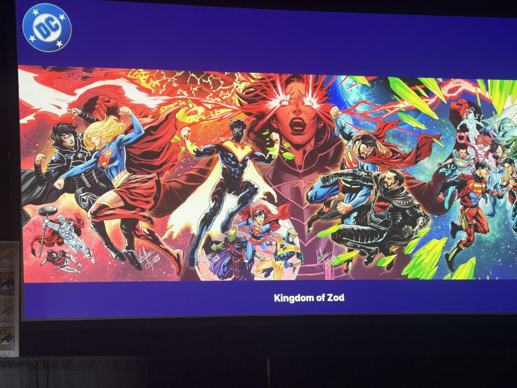 DC Comics poster featuring a colorful group of superheroes in action, with 'Kingdom of Zod' at the bottom and a DC logo in the top-left corner.