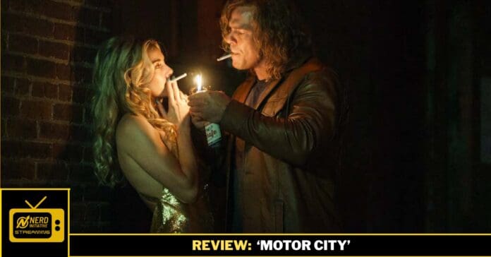 Man lights a cigarette for a woman in a gold dress in a dim, urban alley by a brick wall.