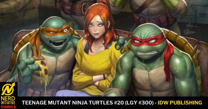 April O'Neil in a yellow top sits between two Ninja Turtles, one with an orange mask and the other with a red mask, on a TMNT #20 cover