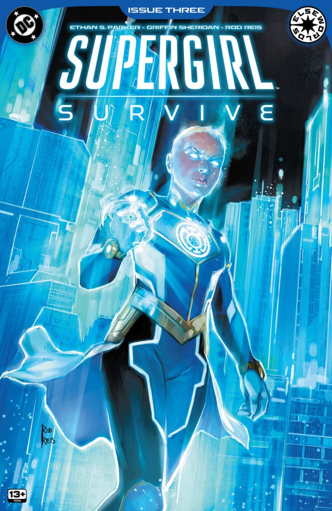 Cover image of a blue-lit superheroine in a futuristic city, cape flowing, glowing eyes, pointing forward; title 'Supergirl' with 'Survive' subtitle above. Issue 3 from the series, 13+ rating shown in corner.