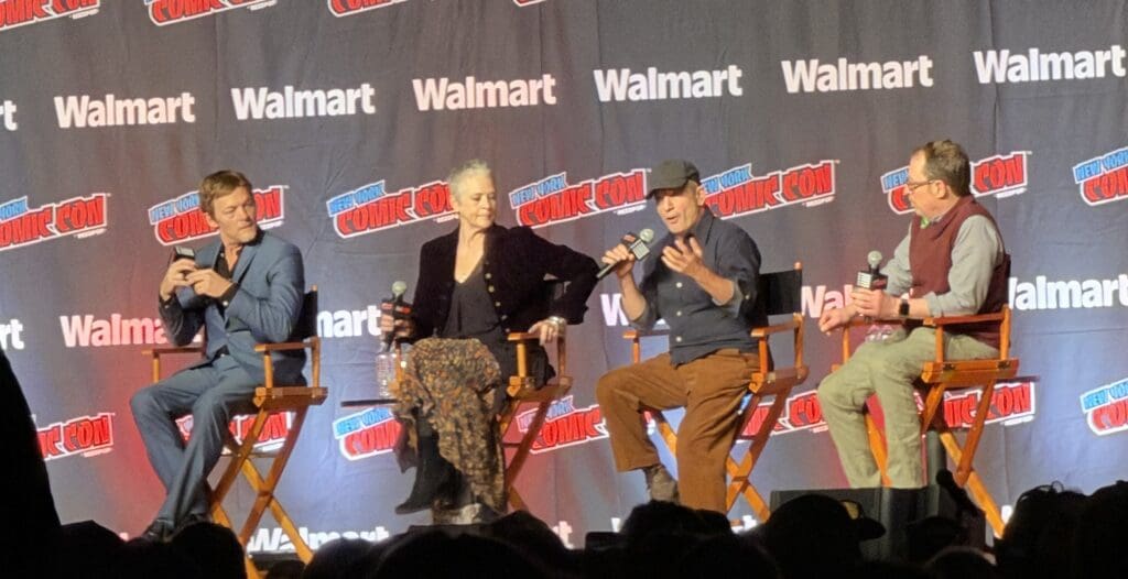 Norman Reedus (Daryl & Executive Producer); Melissa McBride (Carol & Executive Producer); David Zabal (Showrunner and Executive Producer); Scott Gimple (Executive Producer). The AMC panel at NYCC 2026. Image by Nerd Initiative's Lauren Freeman.
